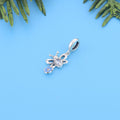 Close-up of the butterfly pendant with a pear-cut cubic zirconia center