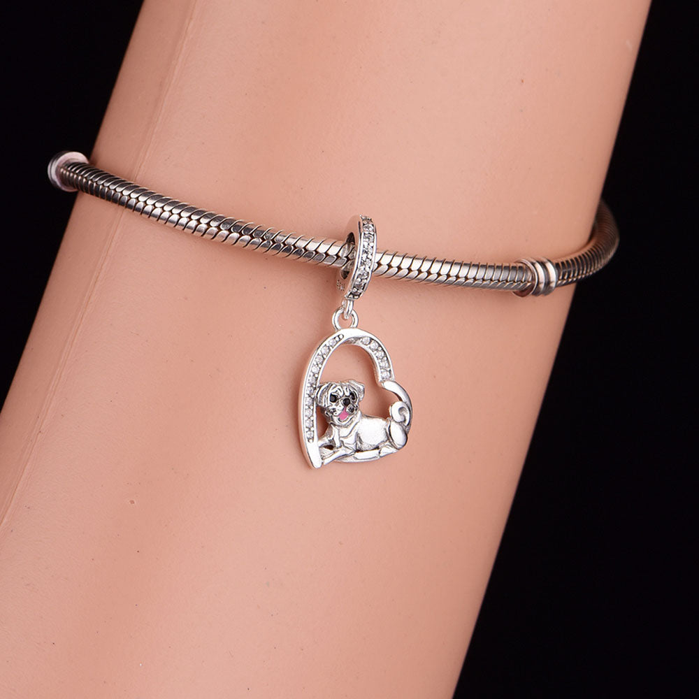 Heart-shaped sterling silver pug charm with sparkling cubic zirconia accents