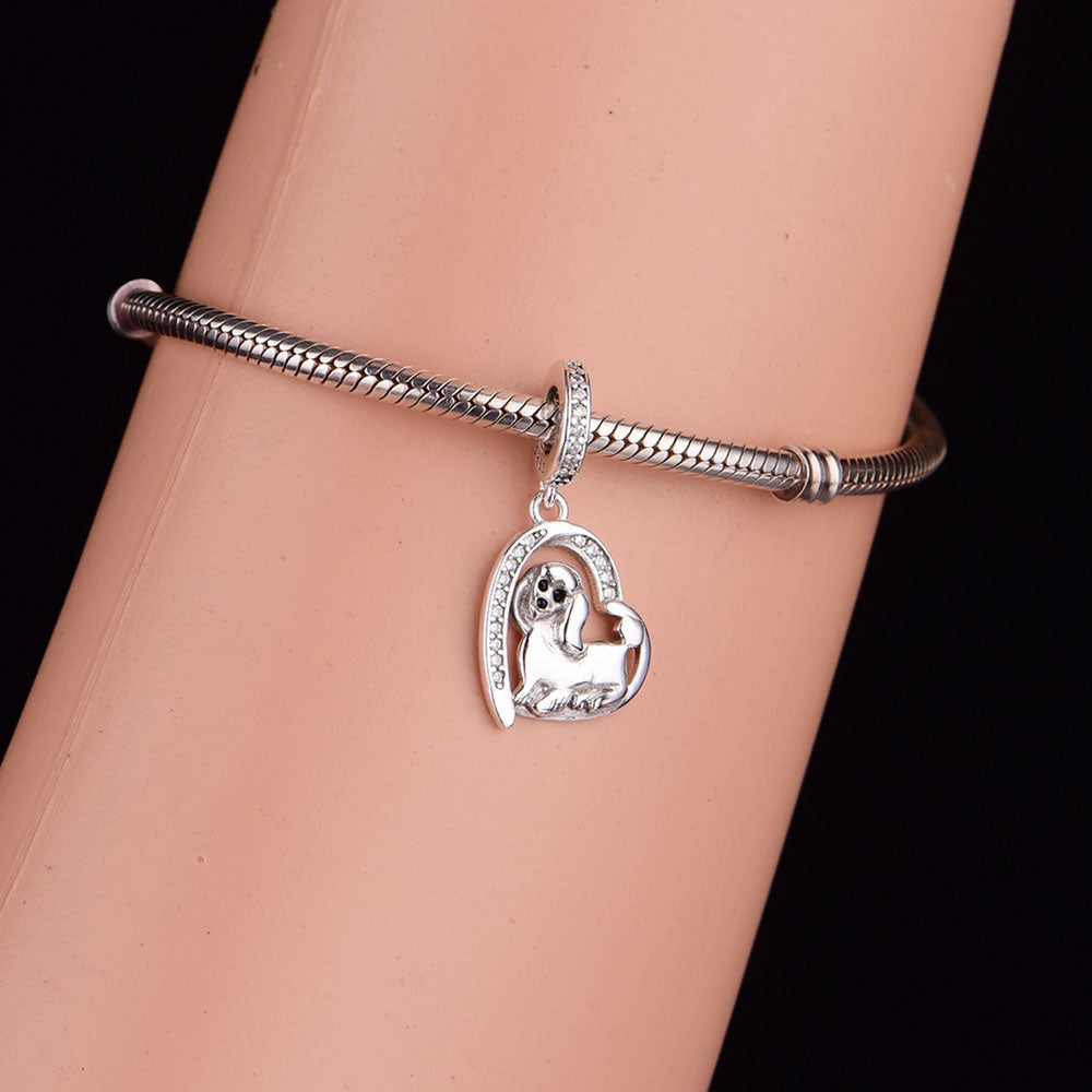 Close-up of the curly fur details on a 925 Sterling Silver poodle charm