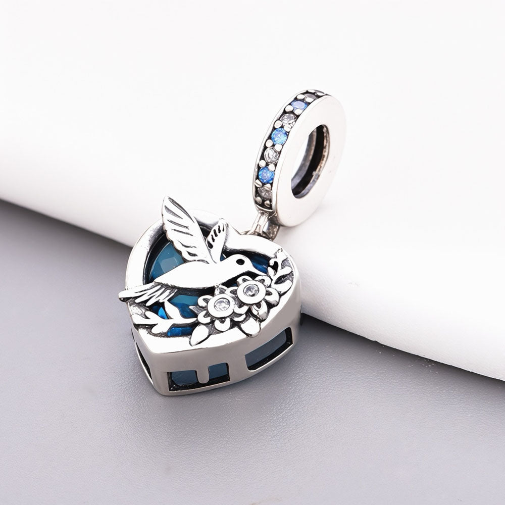 "Ethereal Flight" - 925 Silver Hummingbird & Flower Blue Zirconia Heart Dangle Charm